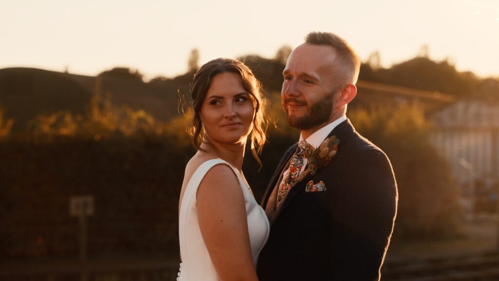 A bride and groom at golden hour captured on film by their wedding videographer from Oxfordshire, HC Visuals. 