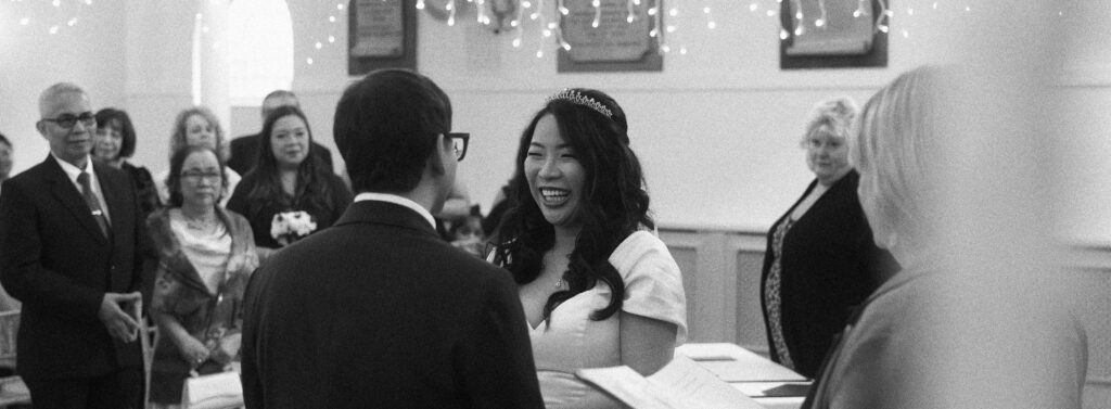 A vintage inspired photo of the bride and groom during their ceremony. 