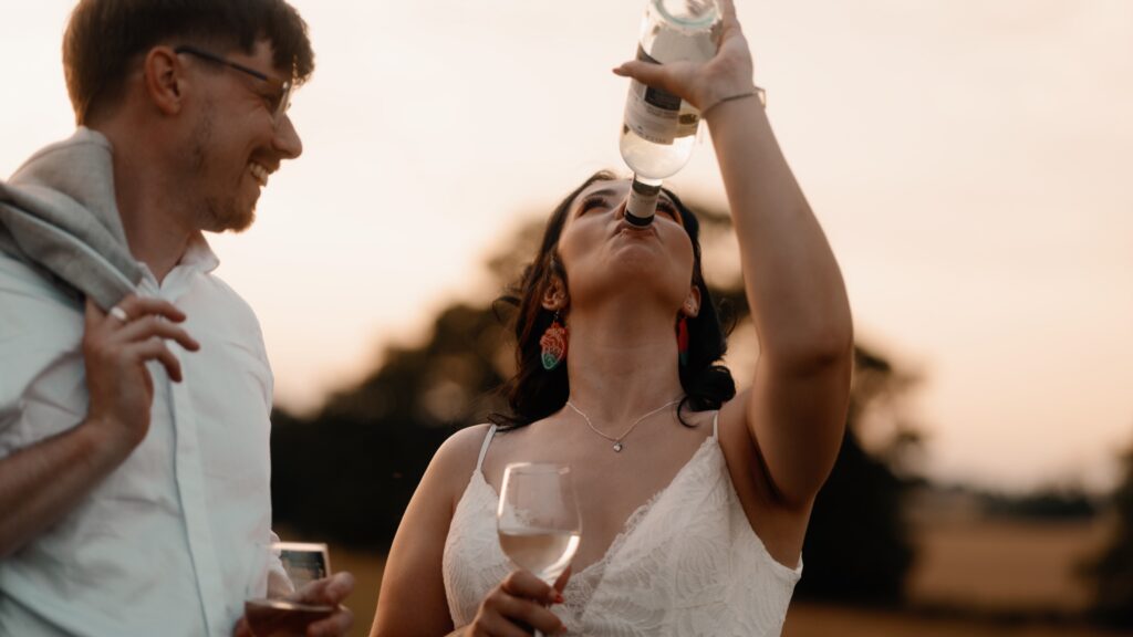 A Bride and Groom share a fun moment together on their wedding day. Captured by alternative wedding videographer HC Visuals.